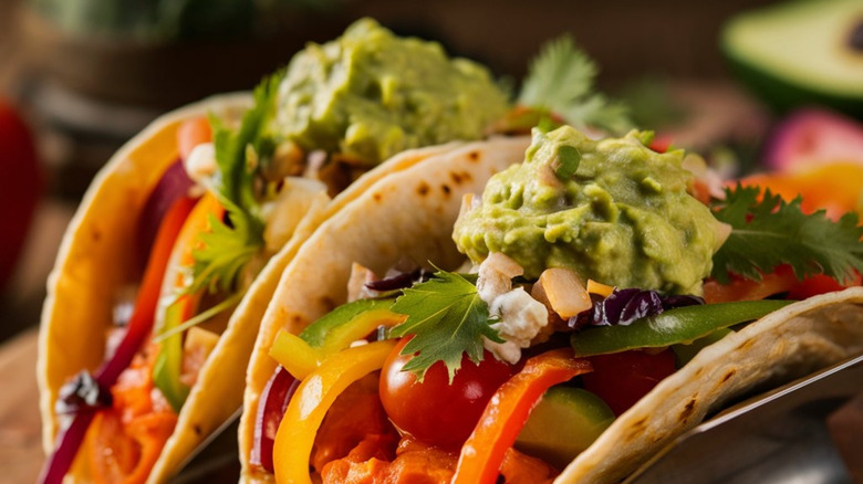 tacos with guacamole and tomatoes