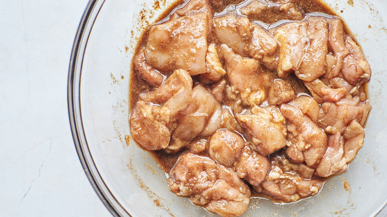 chicken in marinade in bowl