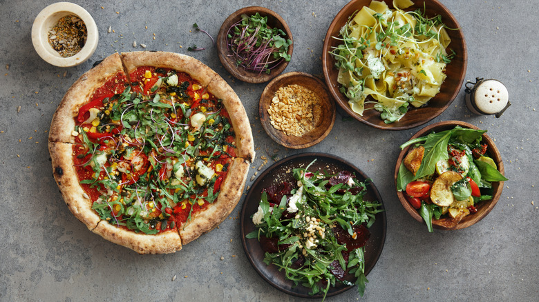 salad over pizza, pasta and in bowls