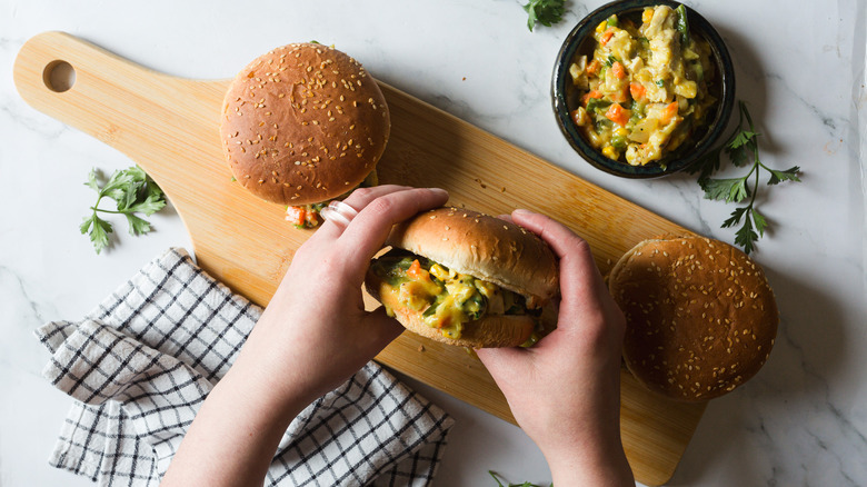 chicken pot pie burgers on wood board