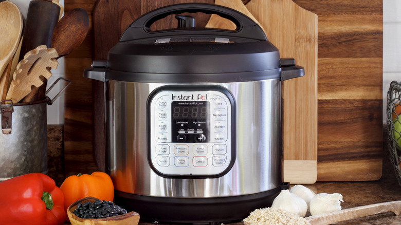 Instant pot on counter with ingredients 
