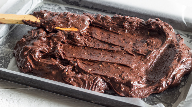 Brownie batter in a pan