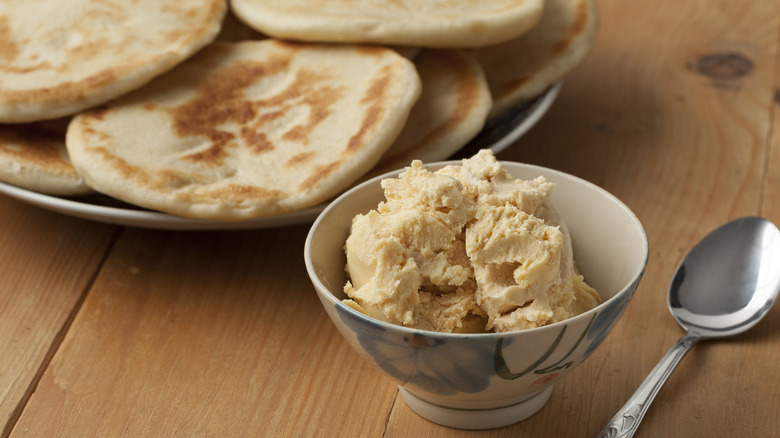 bowl of Moroccan smen with pita bread