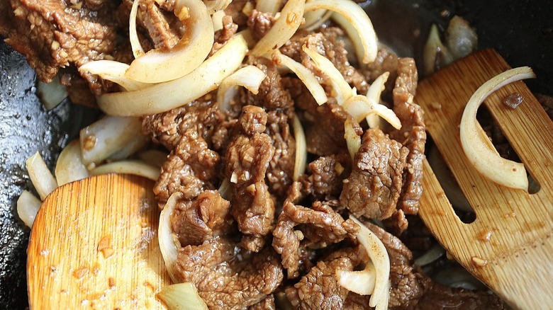 cooked steak strips with onions