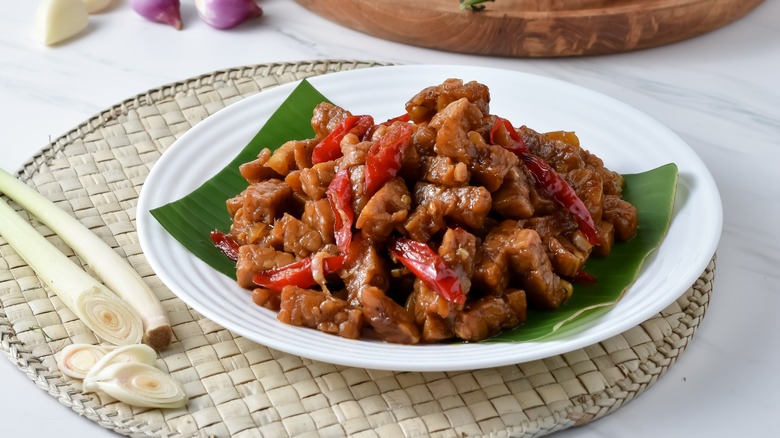 dish with peppers in background