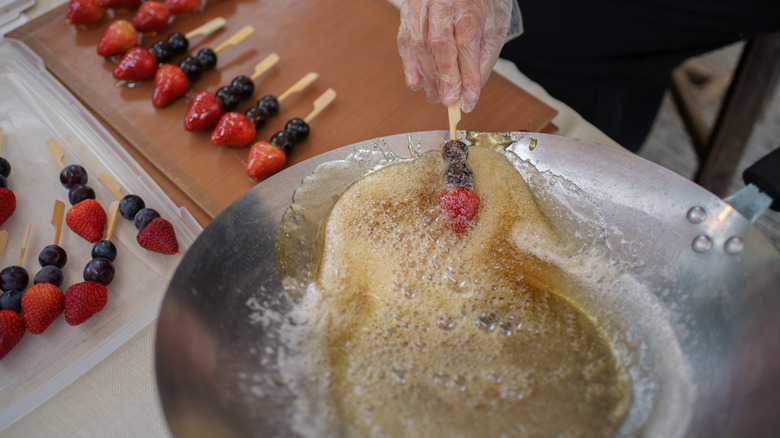 making tanghulu fruit kebabs