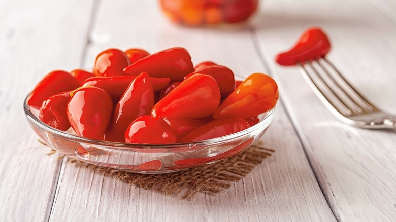 Pickled red peppers in glass bowl