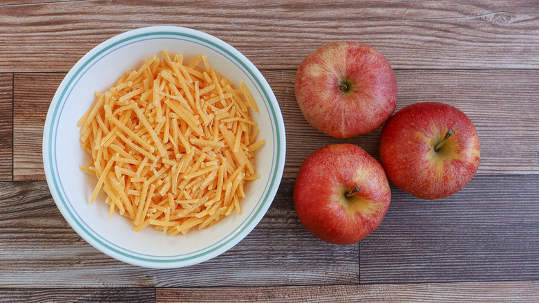 shredded cheddar and apples