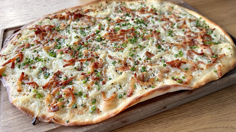 baked tarte flambée cutting board