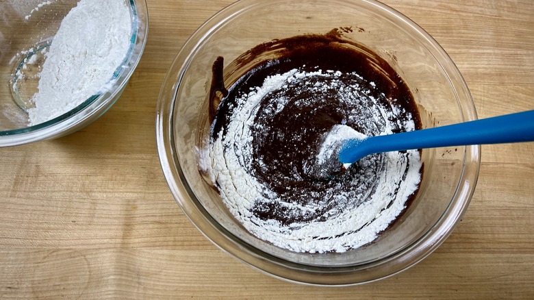 Adding flour to cookie batter