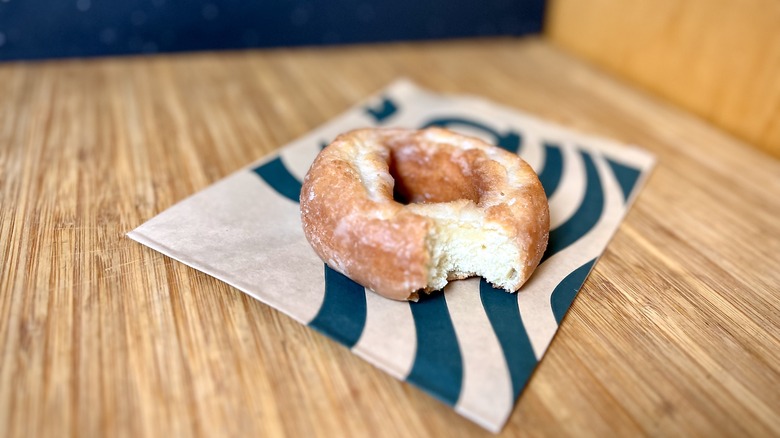 A doughnut missing a bite