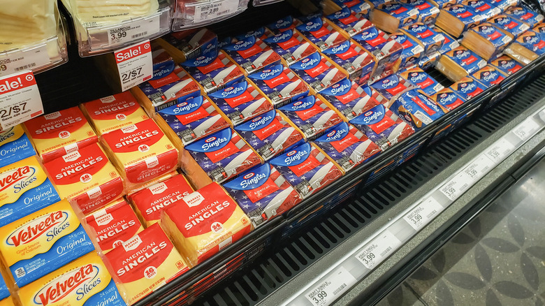 Several brands of sliced cheese