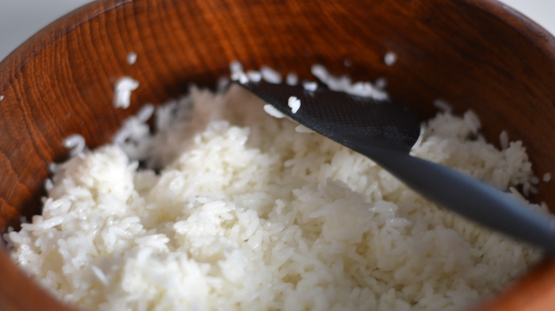 Large wooden bowl of rice