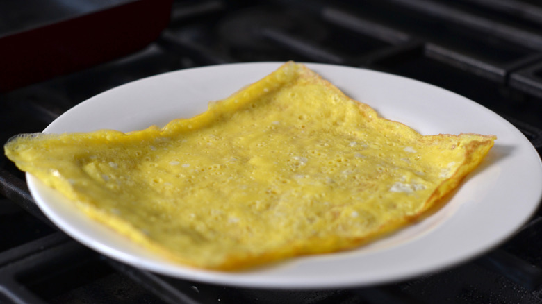 Sheet of egg cooling on a plate