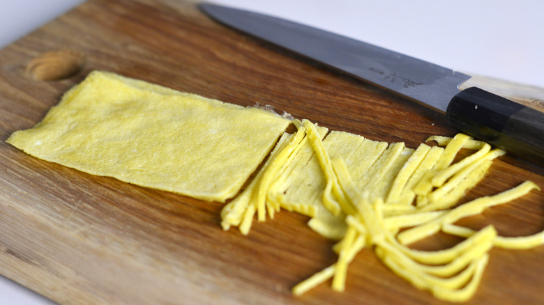 Strips of egg being cut