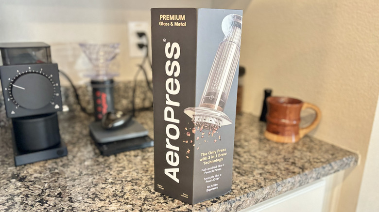 The AeroPress Premium comes in a narrow box shown on a counter.