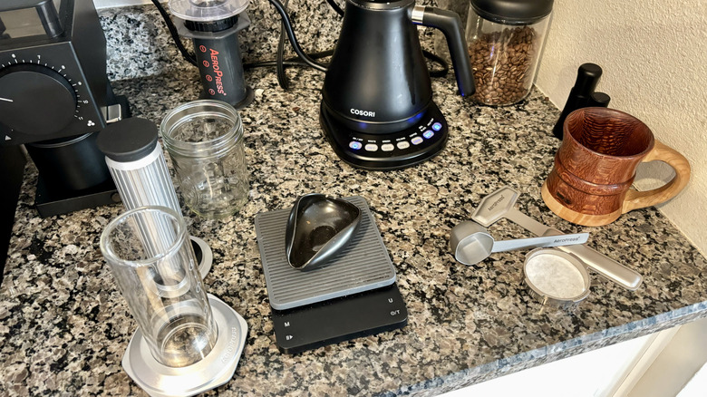 Items are set out on the counter in preparation for making coffee.