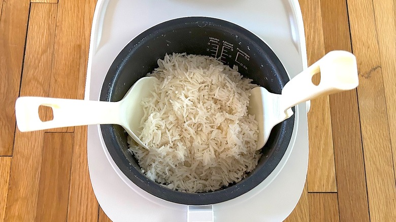 Cooked basmati rice and utensils in cooking pot of Toshiba Mini Rice Cooker