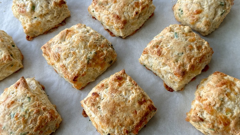 golden brown baked biscuits on baking sheet