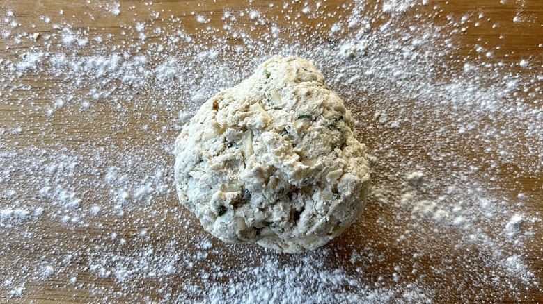 Kneading biscuit dough on floured surface