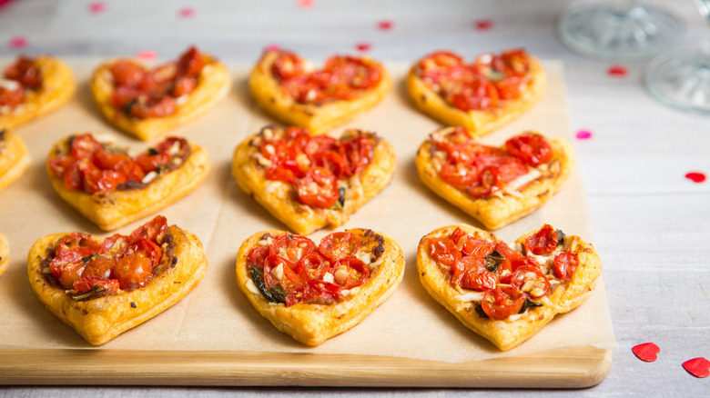 small heart pastries on board 