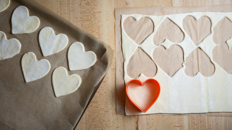 cutting heart shaped pastry pieces 