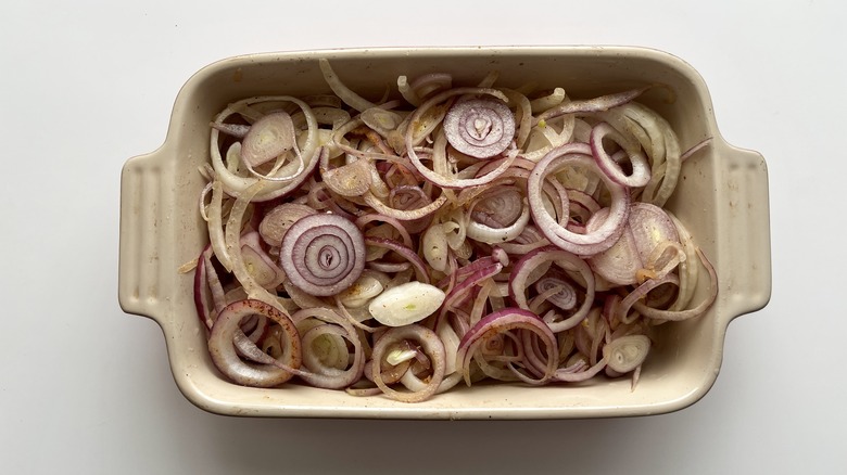 sliced onions in casserole pan