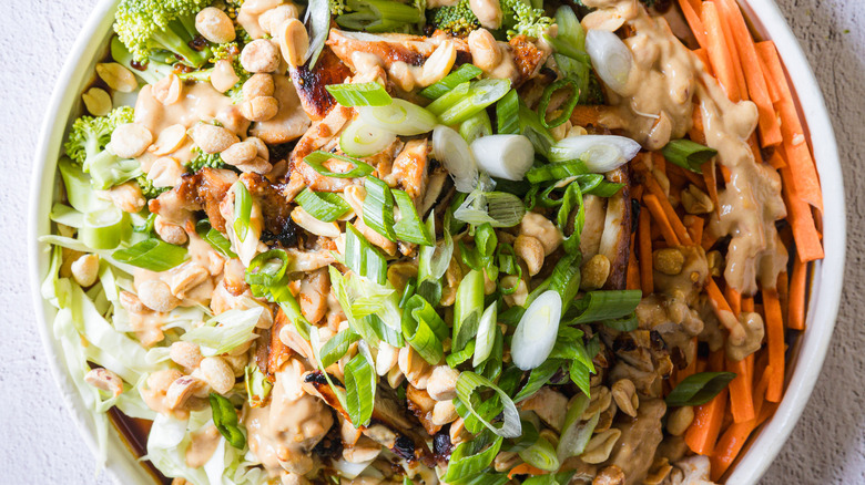 Close up on salad on large white platter