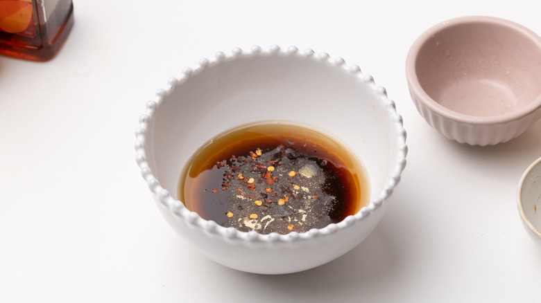 preparing Asian-inspired slaw dressing