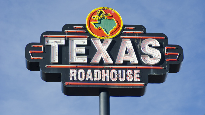 Texas Roadhouse neon sign in daylight