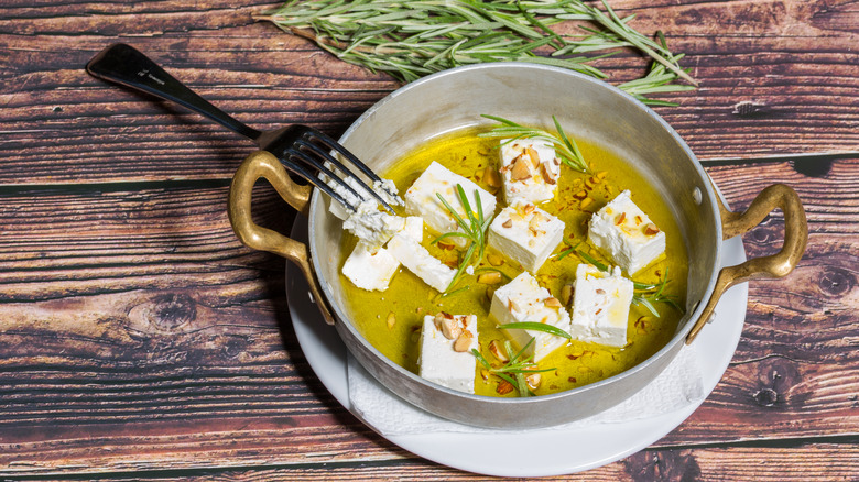 Marinated feta cheese in pot