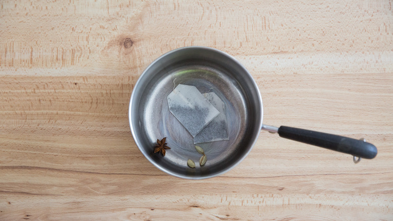 tea and spices in saucepan