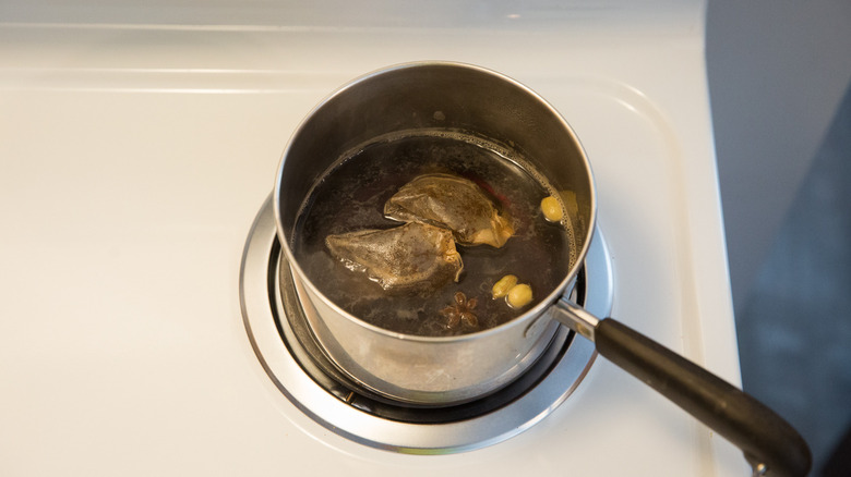 saucepan with simmering spiced tea