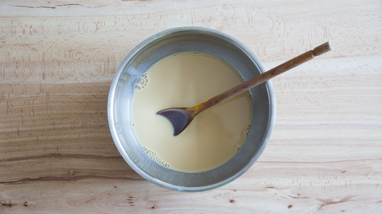 Milky tea in mixing bowl