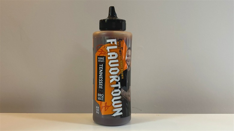 Bottle of Guy Fieri's Flavortown Tennessee BBQ Sauce on white table