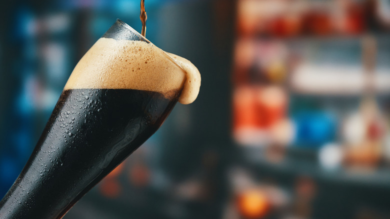 A glass of dark beer