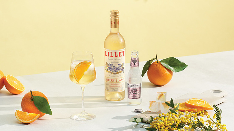 Lillet Blanc bottle with cocktail