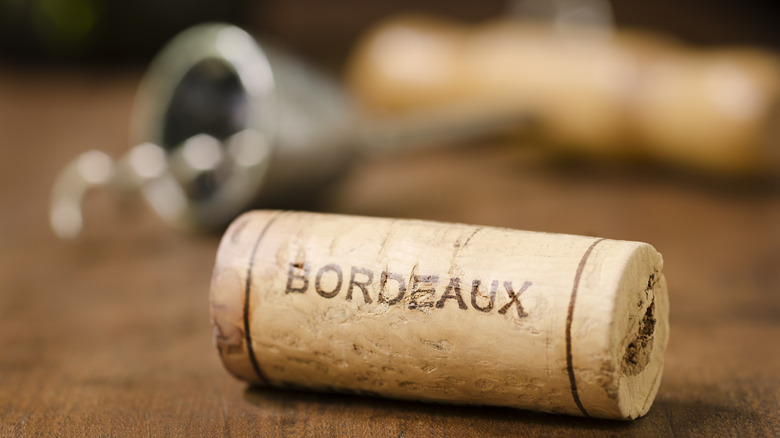 Bordeaux wine cork on table