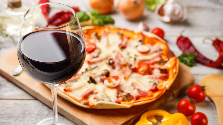 red wine glass with pizza