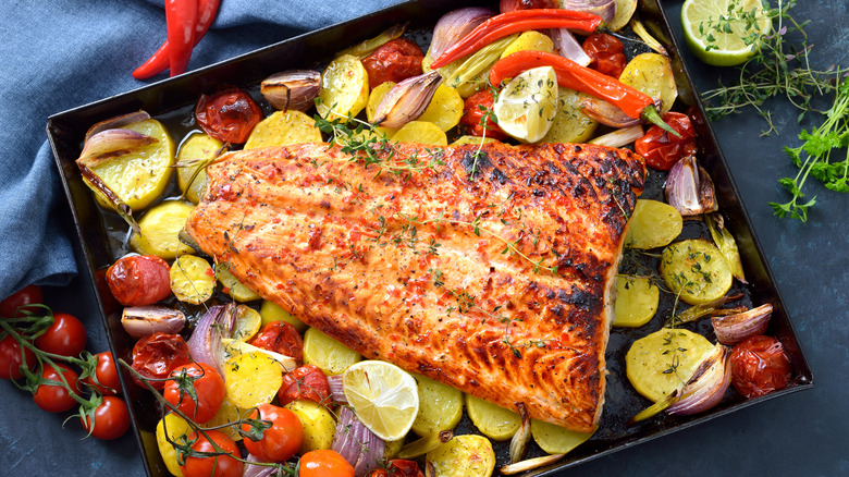 Open sheet trays with salmon vegetables