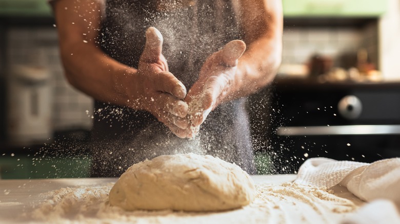 Ball of dough being kneaded