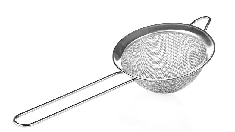 Strainer on white background