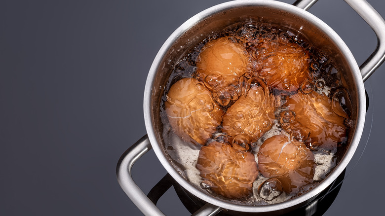 Eggs boiling in saucepan