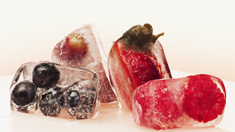 berries in ice cubes