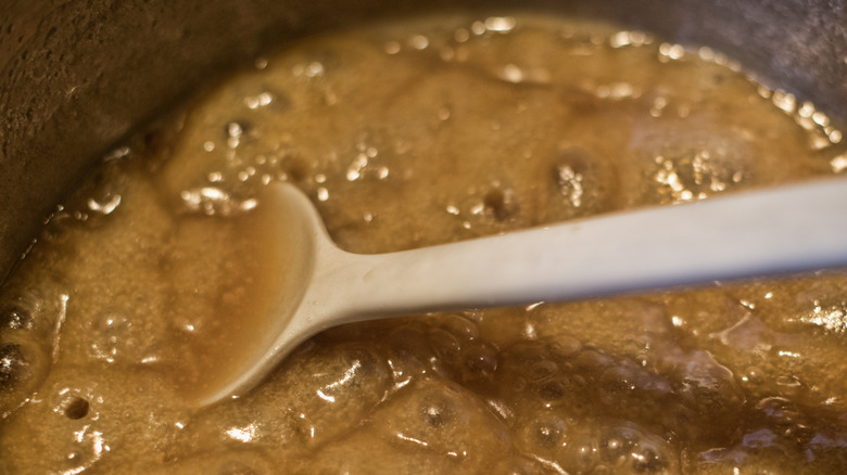 salted caramel sauce simmering in a pot