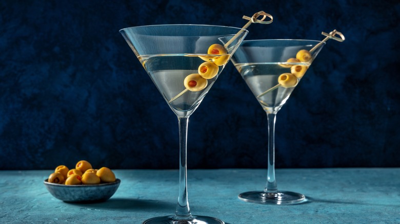 filthy martinis garnished with olives