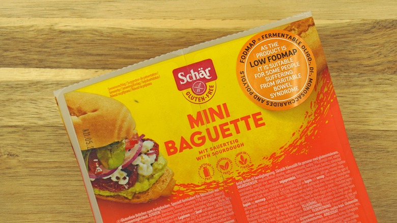 Schär gluten-free mini baguette package on a wooden table