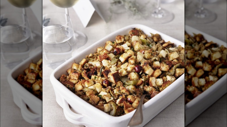 Thanksgiving stuffing in a white dish on a dining table