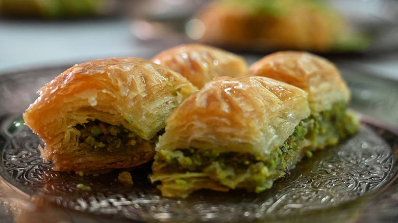 Four pieces of baklava on a plate