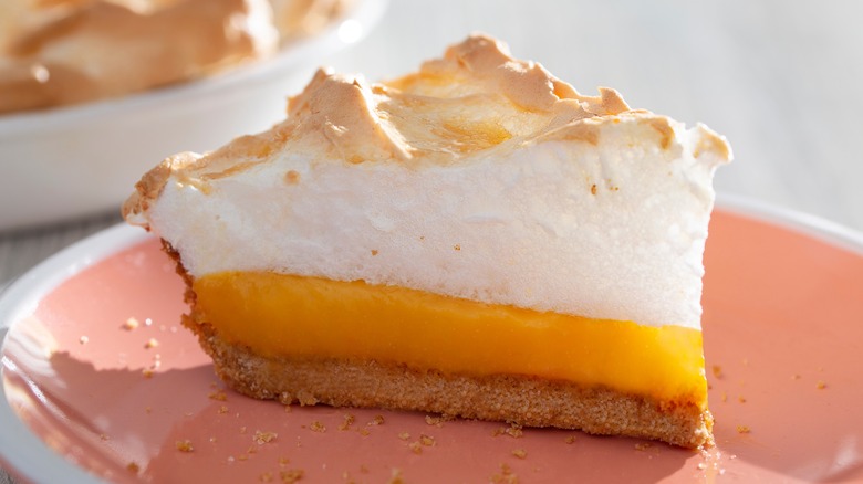 Slice of lemon meringue pie on a plate